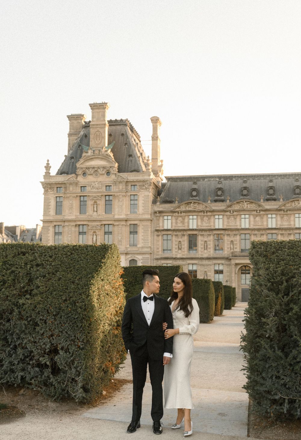 Bride and groom near the Louvre during their Paris elopement photoshoot