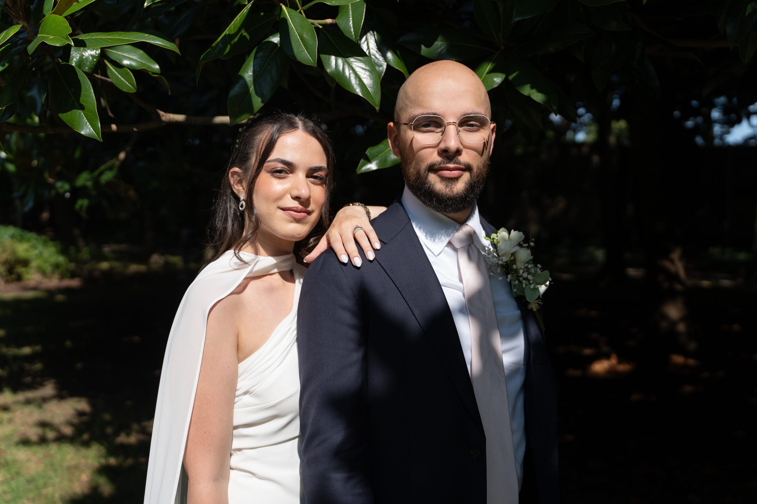 Bride and groom standing together in a garden after their civil wedding in Suresnes, featured in the Paris Wedding Portfolio