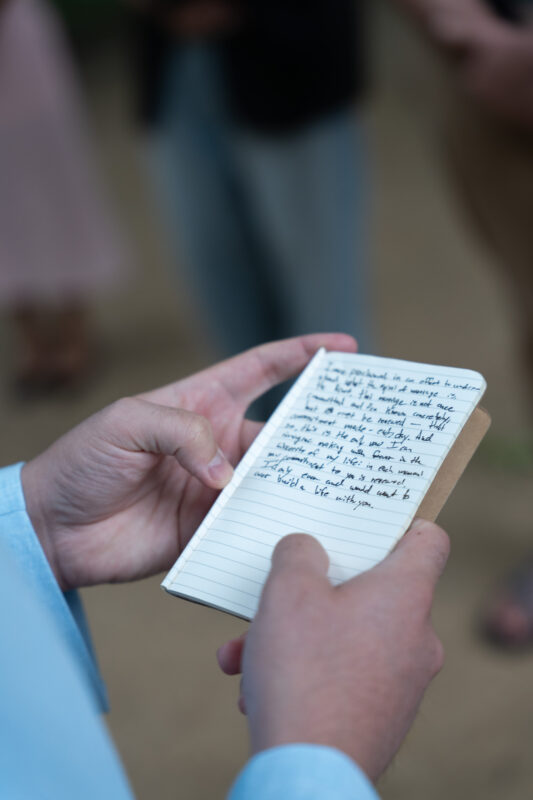 Handwritten vows during an intimate elopement ceremony in Parc Monceau Paris