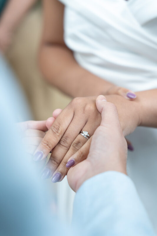 Close-up of wedding rings during a Paris elopement ceremony in Parc Monceau