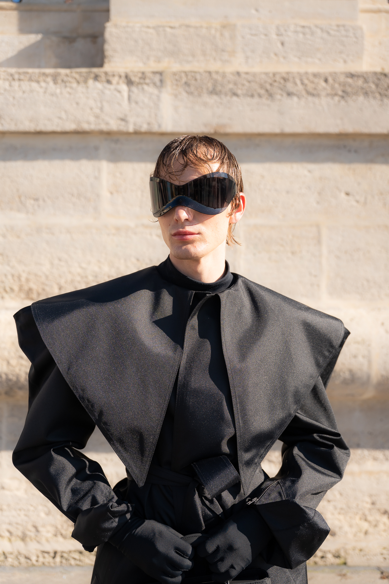 Close fashion portrait of a client wearing visor sunglasses during Paris Fashion Week