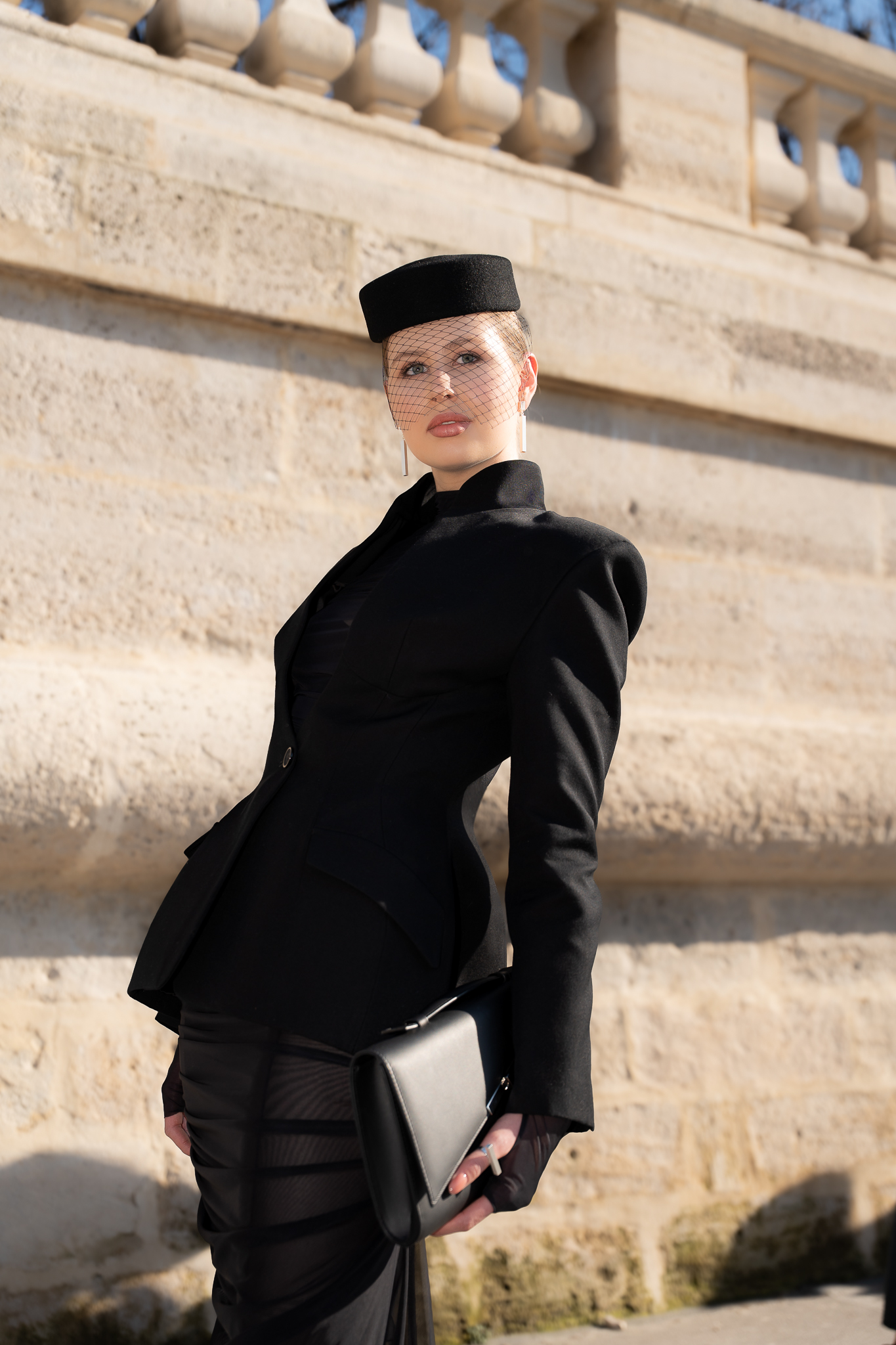 Female client walking in sunglasses during Paris Fashion Week