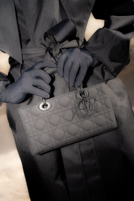 Close-up detail of a black luxury handbag during Paris Fashion Week