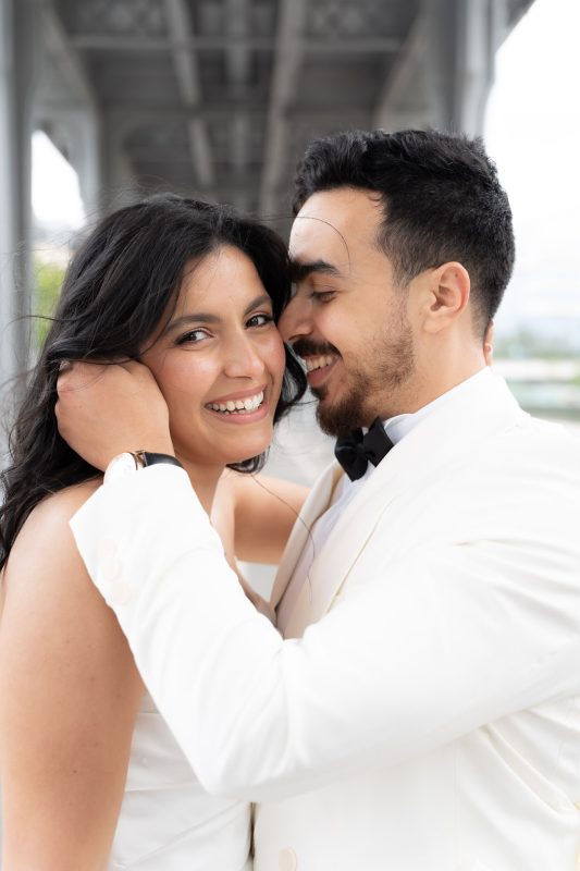 Joyful close-up portrait of newlyweds at Bir-Hakeim after their civil wedding in Île-de-France