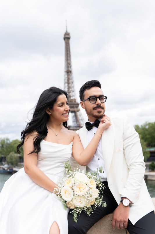 Bride and groom portrait with the Eiffel Tower after their civil wedding in L’Haÿ-les-Roses