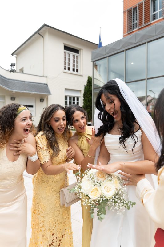 Bride celebrating with bridesmaids after her civil wedding in L’Haÿ-les-Roses
