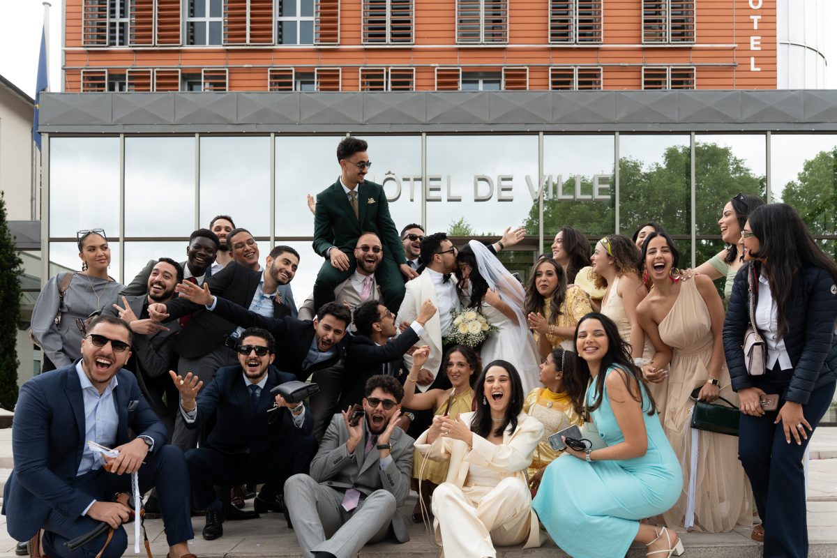 Wedding group photo outside L’Haÿ-les-Roses City Hall after the civil ceremony