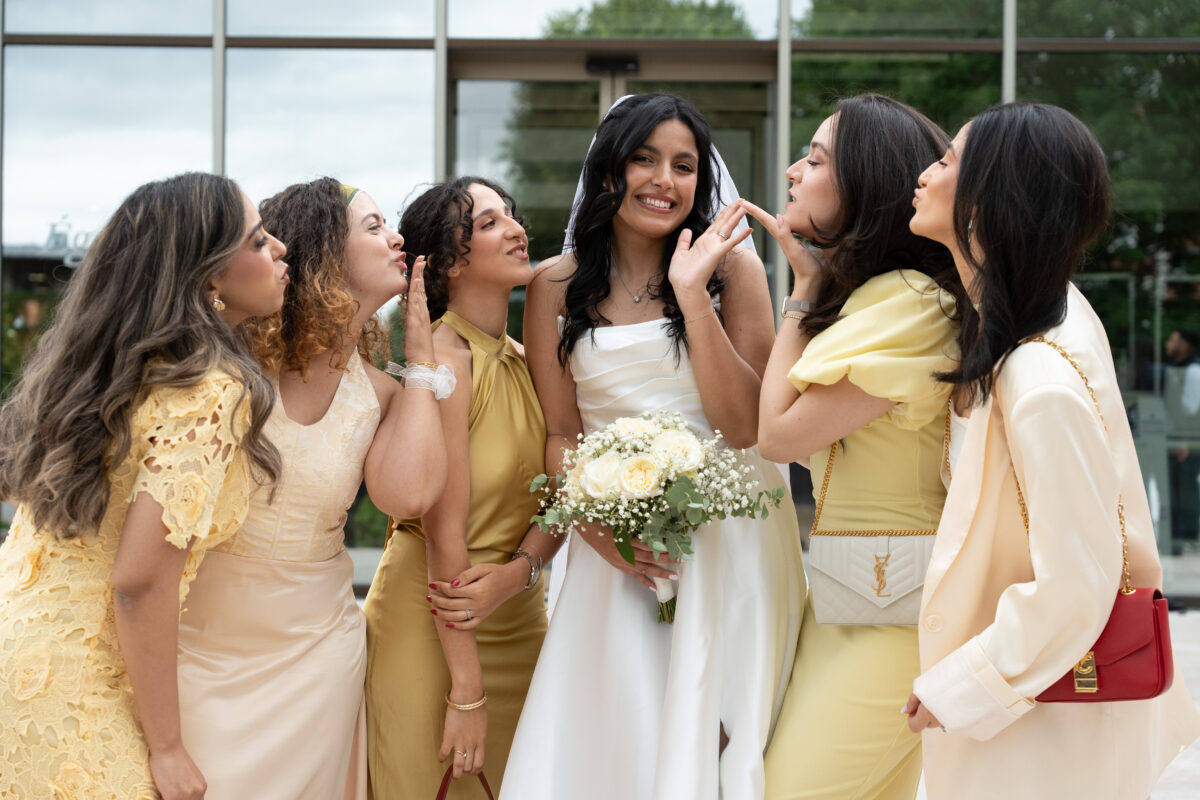 Bride surrounded by bridesmaids outside L’Haÿ-les-Roses City Hall
