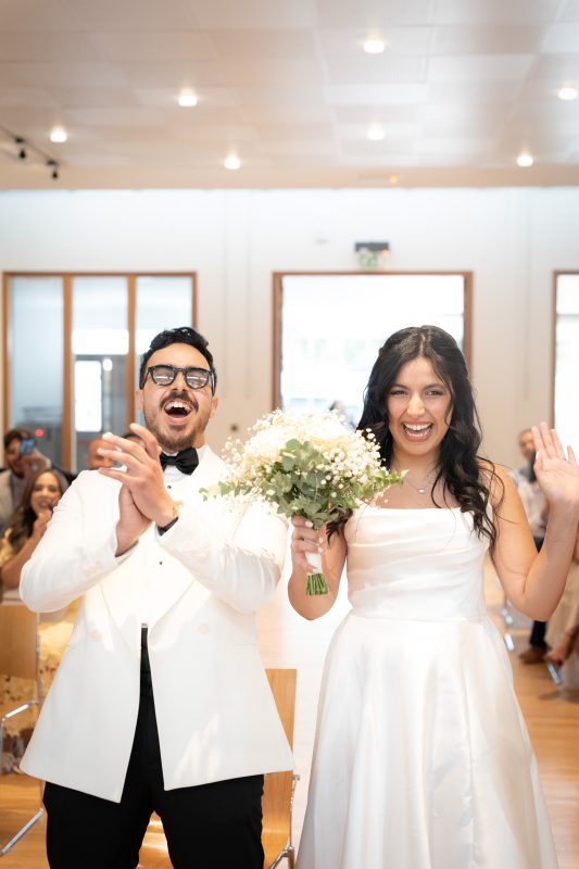 Bride and groom celebrating inside L’Haÿ-les-Roses City Hall after their civil ceremony