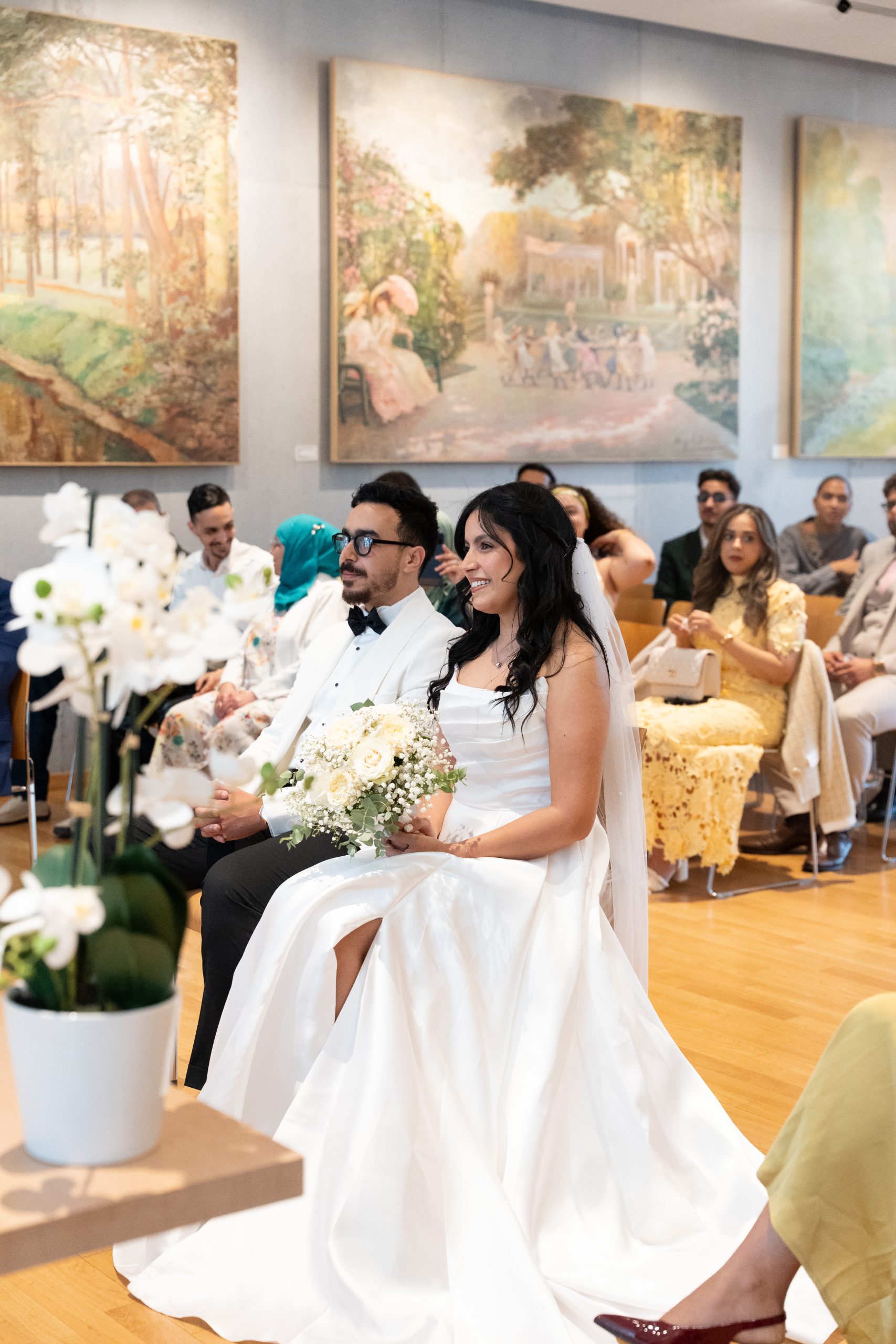 Bride seated during her civil wedding ceremony at L’Haÿ-les-Roses City Hall