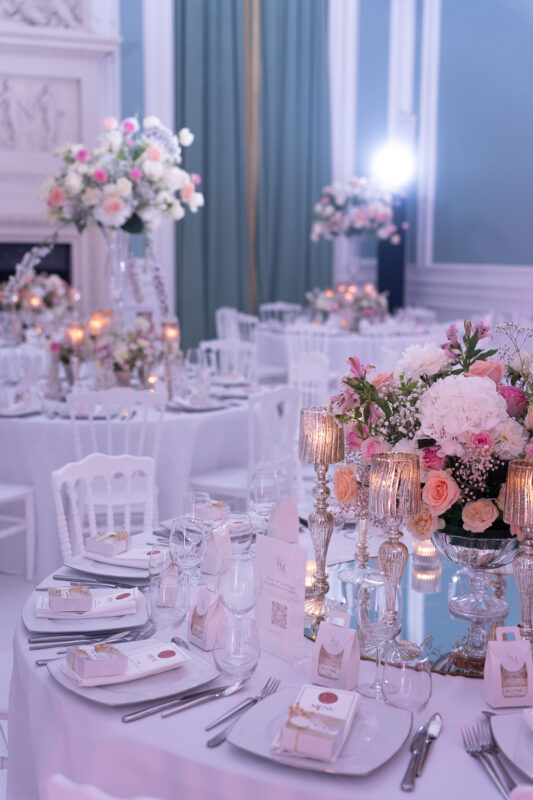 Elegant wedding reception tables decorated with flowers and candles in Île-de-France