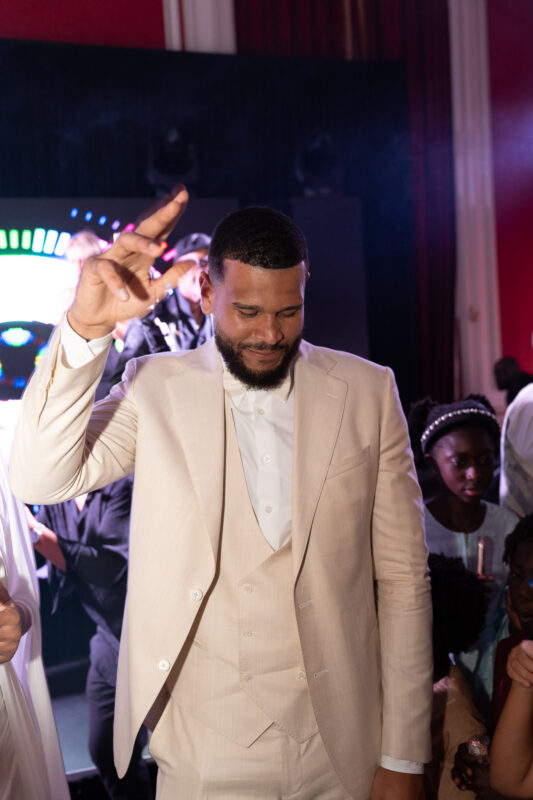 Groom dancing during an elegant wedding reception near Paris