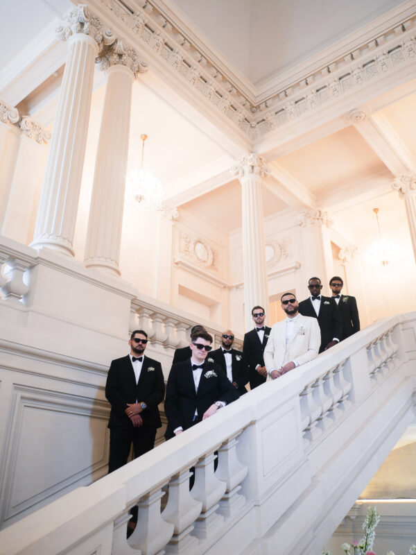 Black-and-white portrait of groom and groomsmen at Château de Saint-Martin-du-Tertre