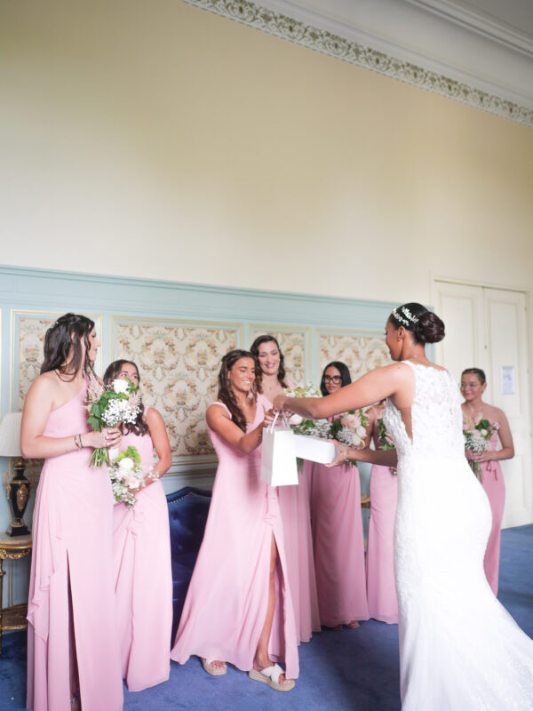 Bridesmaids in pink dresses during a luxury château wedding in Île-de-France
