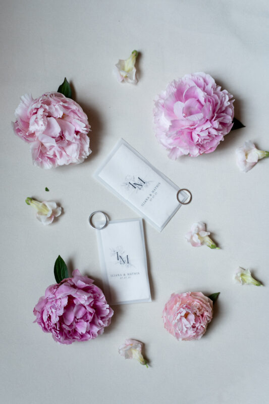 Luxury wedding invitation suite with ring and flowers photographed at Château de Saint-Martin-du-Tertre