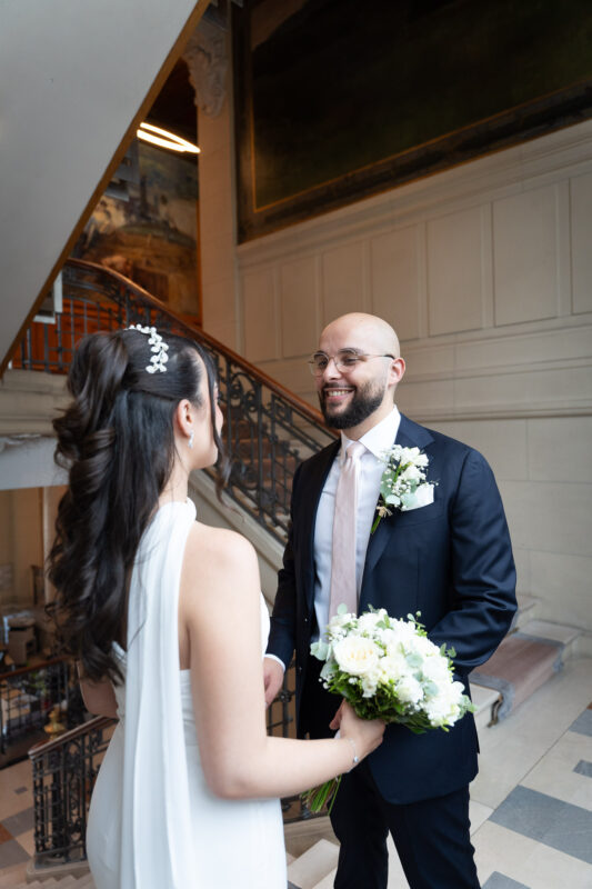 Bride and groom sharing a quiet moment inside Suresnes City Hall