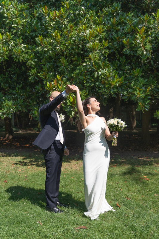 Bride and groom dancing outdoors after their civil wedding at Suresnes City Hall