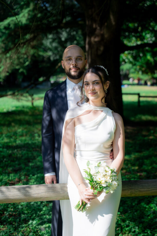 Bride and groom posing in the park after their civil wedding in Suresnes