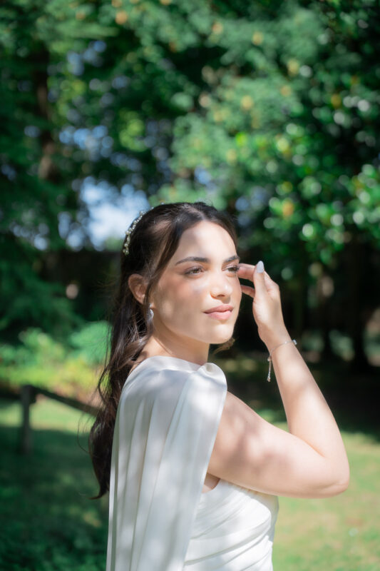 Bride turning toward the camera during an outdoor wedding portrait session in Île-de-France