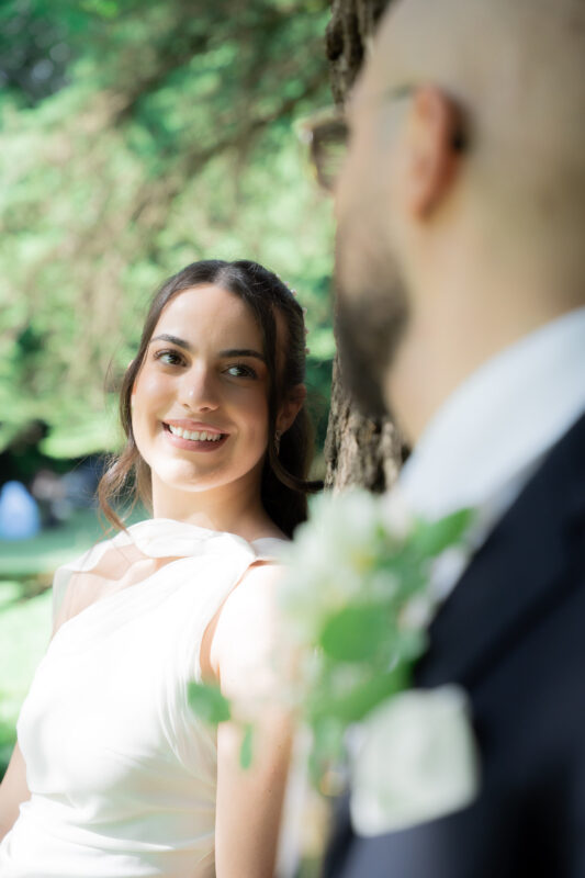 Bride looking at the groom during an outdoor wedding portrait session in Suresnes