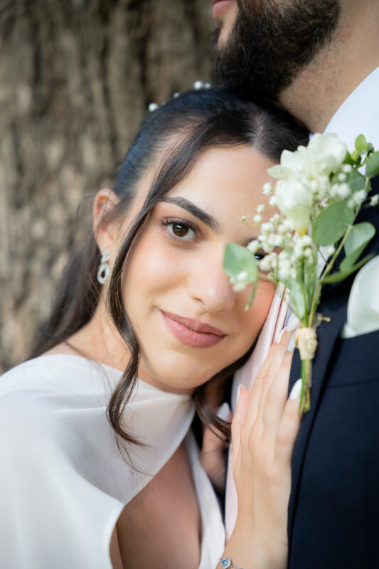 Close-up portrait of the bride with her bouquet after a civil wedding near Paris