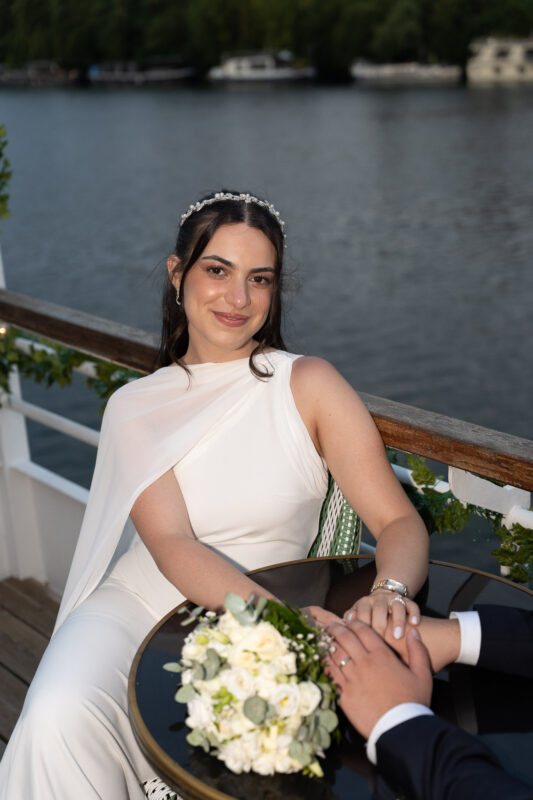 Bride seated outdoors with her bouquet after a civil wedding in Île-de-France